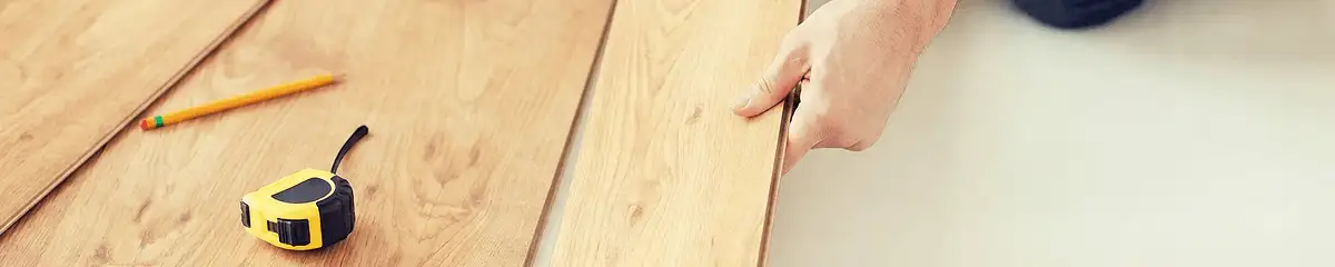 A professional installing wood flooring in Dover, DE