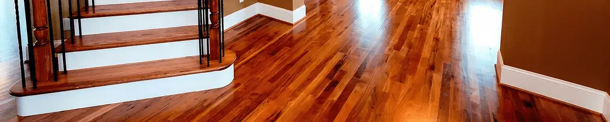 Base floor of a staircase with professionally restored wood flooring in Dover DE