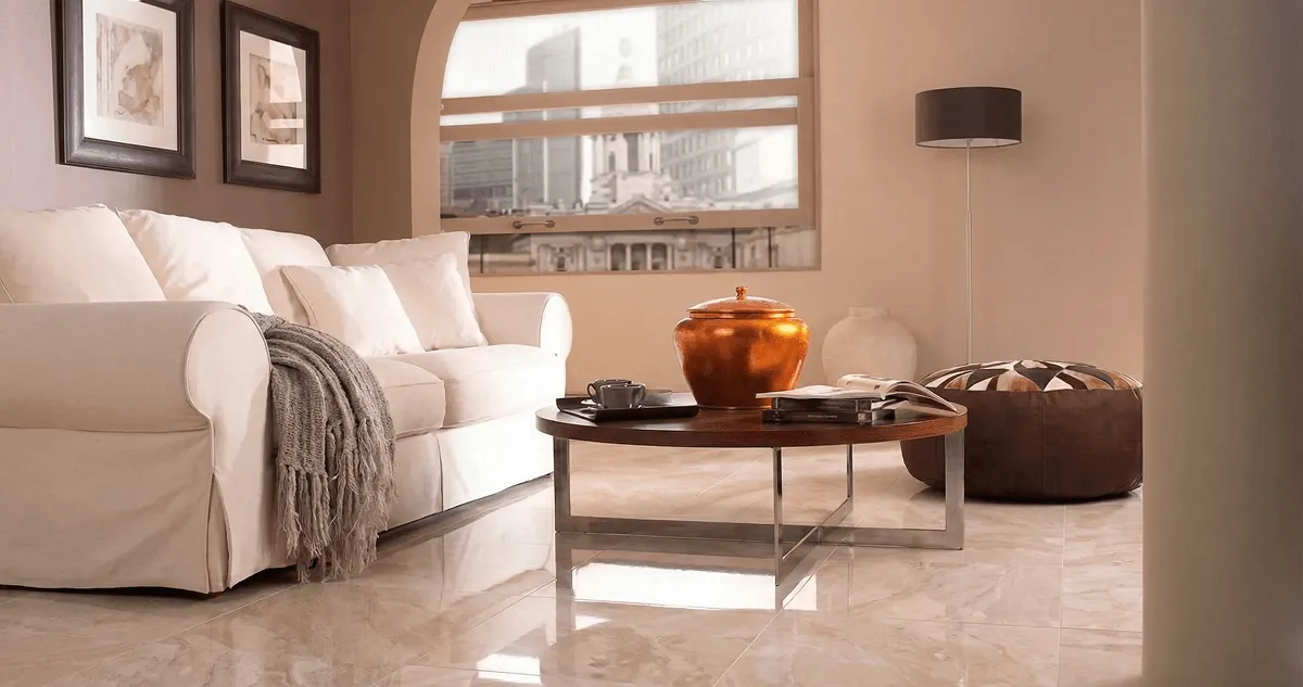 Modern living room with professionally installed marble flooring, a beige sofa, coffee table in Dover, DE