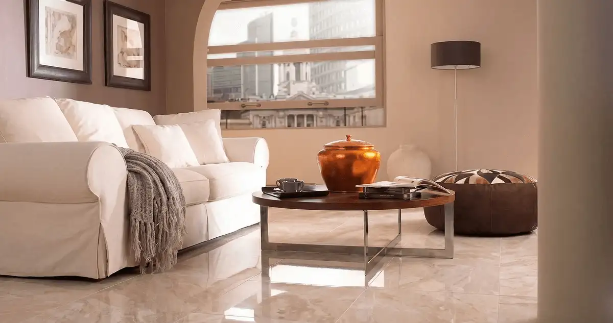 Modern living room with professionally installed marble flooring, a beige sofa, coffee table in Dover, DE