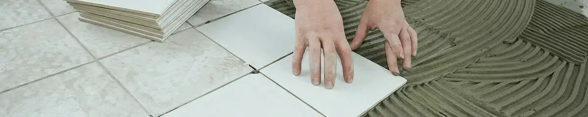 Professional installing white tile floors in Dover, DE