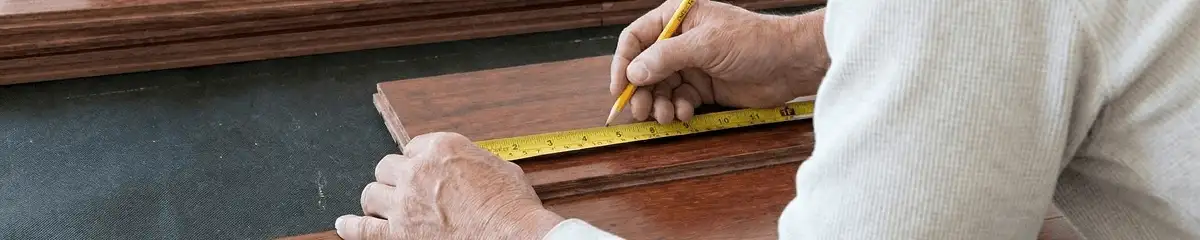 A professional installing wood flooring in Dover, DE